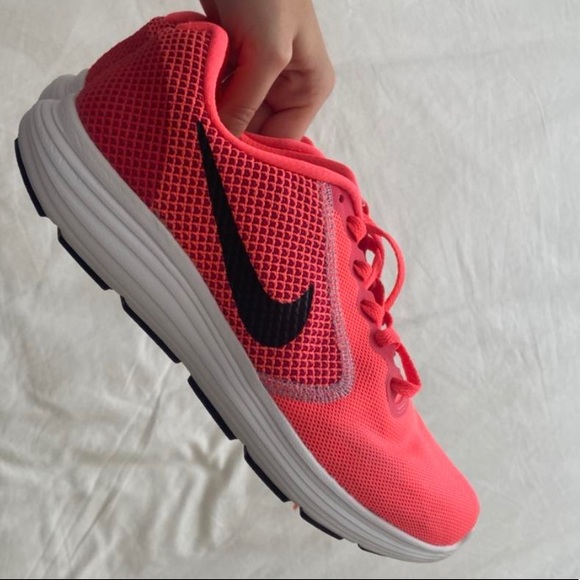 Neon pink Nike running shoes